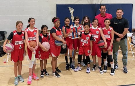 Mayor Carlos Rodriguez and the Huskies girls basketball team